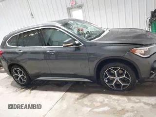 2018 BMW X1 xDrive28i with VIN WBXHT3C38J5L34625, listed as a IAAI auction lot 41133876 with 60,986 mi miles and . Bid and sale history available at DreamBid. Image 13.