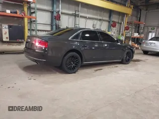 2012 Audi A8 z VIN WAURVAFD6CN014546, wystawiony jako IAAI lot #41357932 z przebiegiem 93 516 mil mil oraz . Historia ofert i sprzedaży dostępna na DreamBid. Obrazek 4.