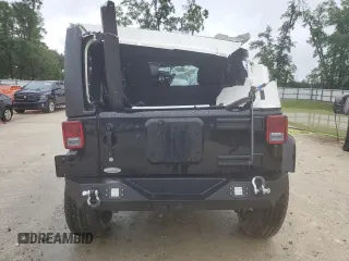 2014 Jeep Wrangler Unlimited Sahara z VIN 1C4HJWEG4EL305998, wystawiony jako Copart lot #56377275 z przebiegiem 60 597 mil mil oraz Szkoda całkowita • Salvage title. Historia ofert i sprzedaży dostępna na DreamBid. Obrazek 6.