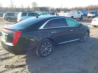 2013 Cadillac XTS z VIN 2G61N5S32D9238652, wystawiony jako IAAI lot #40966692 z przebiegiem 90 834 mil mil oraz . Historia ofert i sprzedaży dostępna na DreamBid. Obrazek 4.