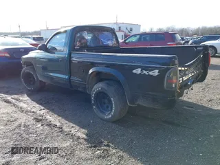 1999 Dodge Dakota SLT with VIN 1B7FL26X0XS208461, listed as a IAAI auction lot 41492338 with 185,400 mi miles. Bid and sale history available at carsss.com. Image 3.