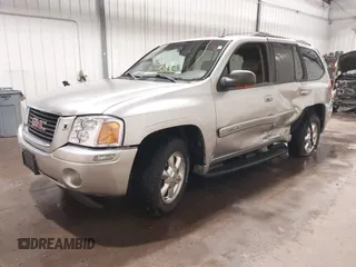 2004 GMC Envoy SLE with VIN 1GKDT13S042243883, listed as a IAAI auction lot 41795335 with 162,873 mi miles. Bid and sale history available at carsss.com. Image 2.