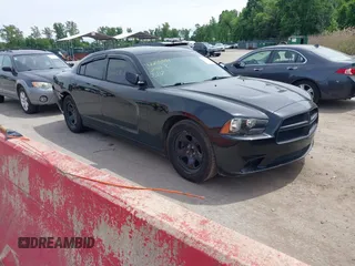 2012 Dodge Charger Police z VIN 2C3CDXAT2CH266806, wystawiony jako IAAI lot #42205044 z przebiegiem 2 292 411 mil mil oraz . Historia ofert i sprzedaży dostępna na DreamBid. Obrazek 1.