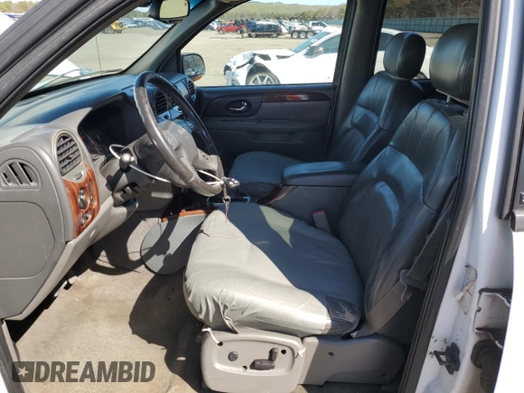 2003 GMC Envoy SLT z VIN 1GKET16S736179347, wystawiony jako Copart lot #52370775 z przebiegiem 230 623 mil mil oraz Szkoda całkowita • Salvage title. Historia ofert i sprzedaży dostępna na DreamBid. Obrazek 7.