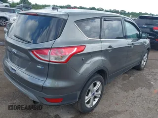 2013 Ford Escape SE with VIN 1FMCU9G95DUC01185, listed as a IAAI auction lot 42602840 with 140,697 mi miles and . Bid and sale history available at DreamBid. Image 4.