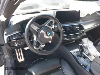 2022 BMW 5 Series M550i xDrive with VIN WBA13BK02NCJ61943, listed as a IAAI auction lot 41607980 with Not provided miles and . Bid and sale history available at DreamBid. Image 21.