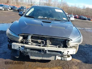 2008 Mitsubishi Lancer Evolution GSR with VIN JA3AW86V18U044077, listed as a IAAI auction lot 41208625 with 157,788 mi miles. Bid and sale history available at carsss.com. Image 6.