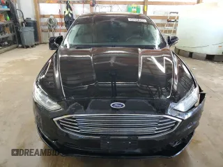 2018 Ford Fusion SE z VIN 3FA6P0H77JR277923, wystawiony jako Copart lot #56897455 z przebiegiem 154 432 mil mil oraz Czysty tytuł • Clean title. Historia ofert i sprzedaży dostępna na DreamBid. Obrazek 5.