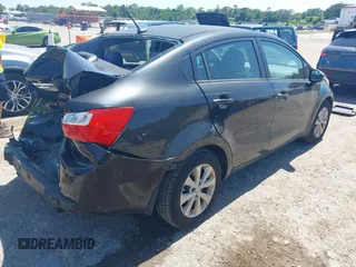 2013 Kia Rio EX with VIN KNADN4A32D6119638, listed as a IAAI auction lot 42313287 with 133,459 mi miles and . Bid and sale history available at DreamBid. Image 4.