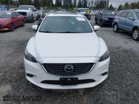 2017 Mazda 6 Grand Touring with VIN JM1GL1X51H1142473, listed as a IAAI auction lot 42234809 with 101,633 mi miles and . Bid and sale history available at DreamBid. Image 13.