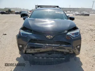 2018 Toyota RAV4 SE with VIN 2T3NFREV6JW436488, listed as a Copart auction lot 60297905 with 74,034 mi miles and Salvage title. Bid and sale history available at DreamBid. Image 5.