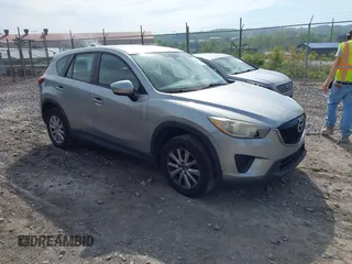 2014 Mazda CX-5 Sport with VIN JM3KE2BE9E0423737, listed as a IAAI auction lot 42222646 with 116,160 mi miles and . Bid and sale history available at DreamBid. Image 1.