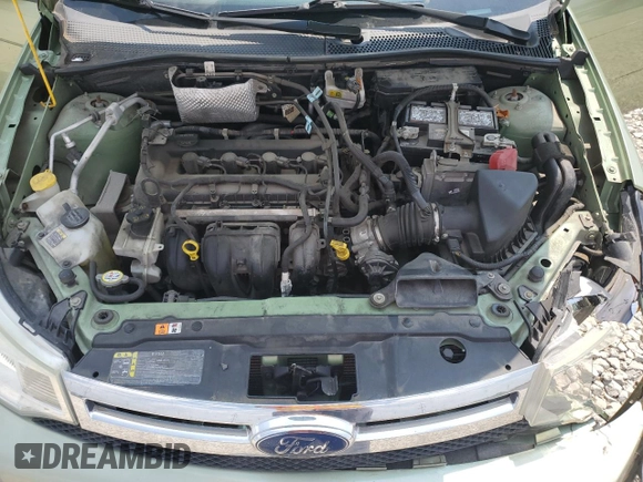 2008 Ford Focus SE z VIN 1FAHP33NX8W141079, wystawiony jako Copart lot #59759325 z przebiegiem 71 522 mil mil oraz Szkoda całkowita • Salvage title. Historia ofert i sprzedaży dostępna na DreamBid. Obrazek 11.