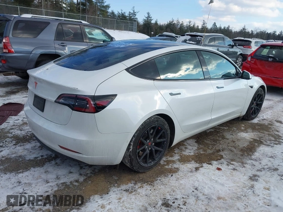 2020 Tesla Model 3 Standard Range Plus with VIN 5YJ3E1EA7LF742973, listed as a IAAI auction lot 41409285 with 48,993 mi miles and . Bid and sale history available at DreamBid. Image 4.