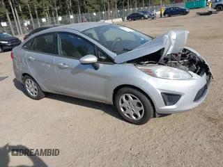 2012 Ford Fiesta SE z VIN 3FADP4BJ5CM118689, wystawiony jako IAAI lot #42105789 z przebiegiem 104 918 mil mil oraz . Historia ofert i sprzedaży dostępna na DreamBid. Obrazek 1.