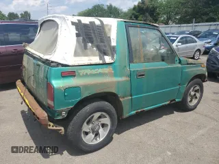 1994 Geo Tracker z VIN 2CNBE18U4R6933505, wystawiony jako Copart lot #68421924 z przebiegiem 203 558 mil mil oraz Szkody całkowita. Historia ofert i sprzedaży dostępna na DreamBid. Obrazek 3.