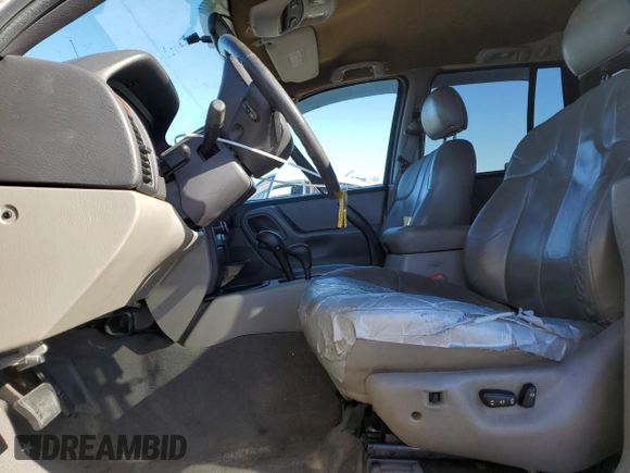 1999 Jeep Grand Cherokee Laredo with VIN 1J4GW58NXXC776438, listed as a Copart auction lot 84412044 with 163,060 mi miles and Salvage title. Bid and sale history available at DreamBid. Image 7.