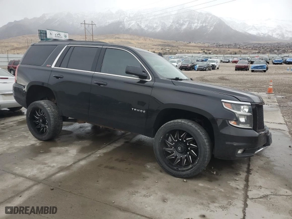 2019 Chevrolet Tahoe LT with VIN 1GNSKBKC7KR306530, listed as a Copart auction lot 42024765 with 122,249 mi miles and Salvage Title. Bid and sale history available at carsss.com. Image 4.