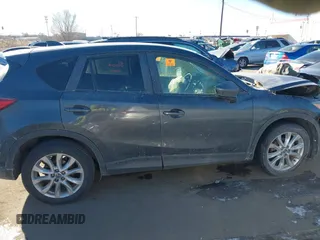 2014 Mazda CX-5 Grand Touring with VIN JM3KE2DY1E0421326, listed as a IAAI auction lot 41330794 with 127,589 mi miles. Bid and sale history available at carsss.com. Image 13.