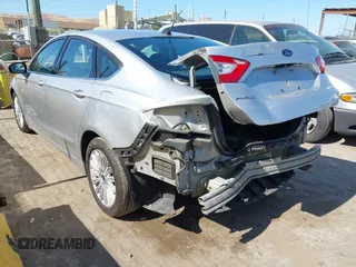 2015 Ford Fusion SE Hybrid with VIN 3FA6P0LUXFR296373, listed as a IAAI auction lot 42600980 with 76,985 mi miles and . Bid and sale history available at DreamBid. Image 3.