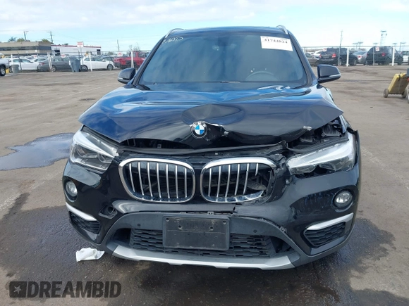 2017 BMW X1 sDrive28i with VIN WBXHU7C3XHP924635, listed as a IAAI auction lot 41744824 with 74,143 mi miles. Bid and sale history available at carsss.com. Image 6.