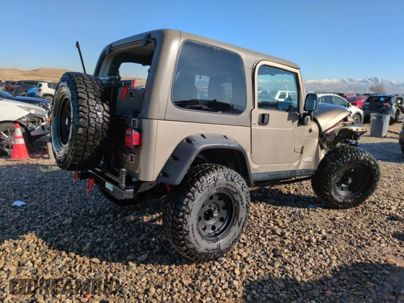 2004 Jeep Wrangler Rubicon with VIN 1J4FA69S14P749749, listed as a Copart auction lot 44458485 with 99,121 mi miles and Salvage Title. Bid and sale history available at carsss.com. Image 3.
