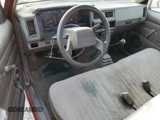 1989 Nissan Hardbody z VIN 1N6ND11S0KC342434, wystawiony jako Copart lot #71089274 z przebiegiem 300 076 mil mil oraz Szkody całkowita. Historia ofert i sprzedaży dostępna na DreamBid. Obrazek 8.