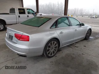 2013 Audi A8 4.0L с VIN WAUA2AFD5DN017770, выставлен на аукционе IAAI как лот 41255625 с пробегом 115 993 миль миль и . История ставок и продаж доступна на DreamBid. Изображение 4.