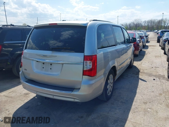 2011 Chrysler Town & Country Touring L with VIN 2A4RR8DG8BR797653, listed as a IAAI auction lot 42115304 with 185,613 mi miles and . Bid and sale history available at DreamBid. Image 4.
