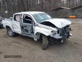 2022 Toyota Tacoma SR with VIN 3TYAX5GN3NT062077, listed as a IAAI auction lot 41886531 with 58,687 mi miles and . Bid and sale history available at DreamBid. Image 1.