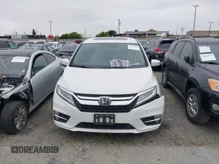 2020 Honda Odyssey Touring with VIN 5FNRL6H81LB028083, listed as a IAAI auction lot 42003810 with 71,536 mi miles and . Bid and sale history available at DreamBid. Image 12.