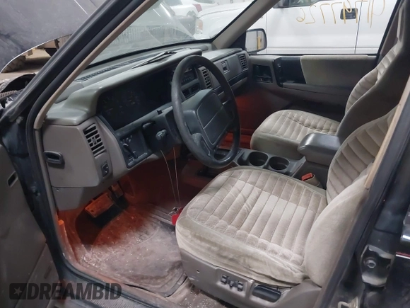 1995 Jeep Grand Cherokee Laredo with VIN 1J4GZ58S6SC765863, listed as a IAAI auction lot 41797726 with 234,715 mi miles and . Bid and sale history available at DreamBid. Image 14.
