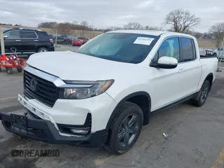 2023 Honda Ridgeline RTL with VIN 5FPYK3F55PB018188, listed as a IAAI auction lot 41952319 with 73,019 mi miles and . Bid and sale history available at DreamBid. Image 2.