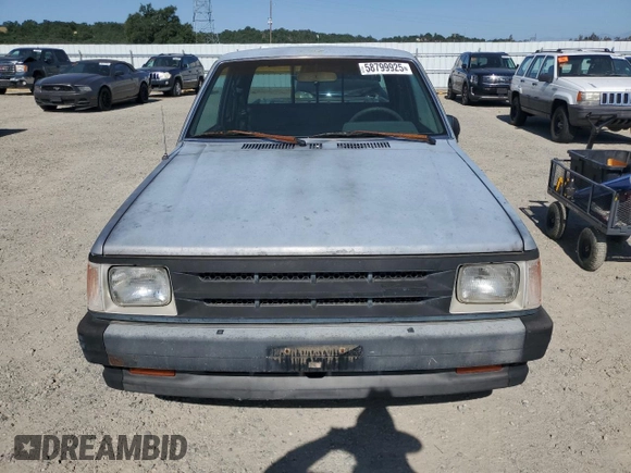 1993 Mazda B-Series Truck z VIN JM2UF3130P0378304, wystawiony jako Copart lot #58799925 z przebiegiem 132 801 mil mil oraz Szkoda całkowita • Salvage title. Historia ofert i sprzedaży dostępna na DreamBid. Obrazek 5.