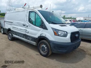 2024 Ford Transit Cargo with VIN 1FTBR1Y89RKA01132, listed as a IAAI auction lot 42668811 with 31,666 mi miles and . Bid and sale history available at DreamBid. Image 1.