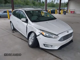 2018 Ford Focus Titanium z VIN 1FADP3N27JL314856, wystawiony jako IAAI lot #42553390 z przebiegiem 82 936 mil mil oraz . Historia ofert i sprzedaży dostępna na DreamBid. Obrazek 1.