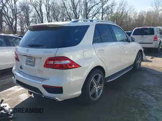 2015 Mercedes-Benz M 63 AMG with VIN 4JGDA7EB6FA471585, listed as a IAAI auction lot 41883006 with 39,243 mi miles and . Bid and sale history available at carsss.com. Image 4.