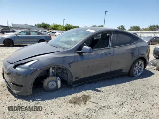 2024 Tesla Model Y Long Range with VIN 7SAYGDEEXRF058614, listed as a Copart auction lot 63615625 with 23,034 mi miles and Salvage title. Bid and sale history available at DreamBid. Image 1.