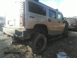 2003 Hummer H2 with VIN 5GRGN23U33H110037, listed as a IAAI auction lot 41339142 with 166,795 mi miles. Bid and sale history available at carsss.com. Image 4.