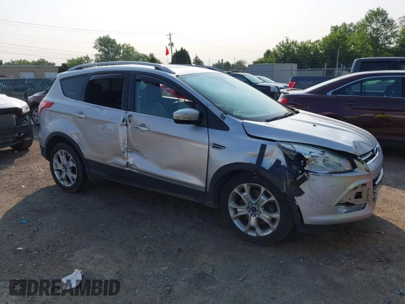 2015 Ford Escape Titanium z VIN 1FMCU0J90FUC02039, wystawiony jako IAAI lot #42369882 z przebiegiem 156 287 mil mil oraz . Historia ofert i sprzedaży dostępna na DreamBid. Obrazek 6.