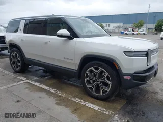 2025 Rivian R1S Adventure with VIN 7PDSGBBA1SN045355, listed as a IAAI auction lot 41491180 with 12,974 mi miles. Bid and sale history available at carsss.com. Image 1.
