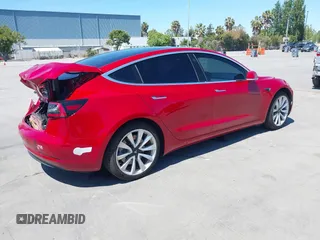 2018 Tesla Model 3 Long Range Battery z VIN 5YJ3E1EAXJF048839, wystawiony jako IAAI lot #42328412 z przebiegiem 83 083 mil mil oraz . Historia ofert i sprzedaży dostępna na DreamBid. Obrazek 4.