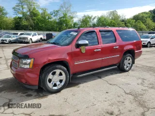 2012 Chevrolet Suburban LTZ with VIN 1GNSKKE7XCR219396, listed as a Copart auction lot 57053215 with 206,110 mi miles and Salvage title. Bid and sale history available at DreamBid. Image 1.