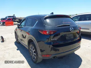 2018 Mazda CX-5 Touring z VIN JM3KFACM3J1339074, wystawiony jako IAAI lot #42317039 z przebiegiem 82 799 mil mil oraz . Historia ofert i sprzedaży dostępna na DreamBid. Obrazek 3.