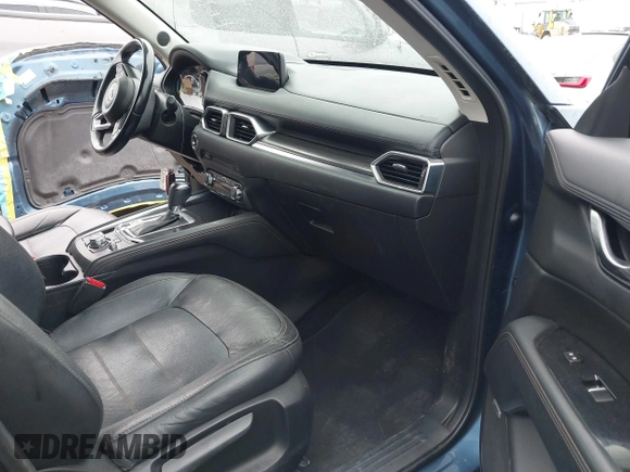 2017 Mazda CX-5 Grand Touring with VIN JM3KFADL9H0187338, listed as a IAAI auction lot 41382034 with 141,972 mi miles and . Bid and sale history available at carsss.com. Image 5.