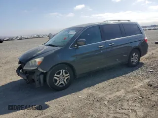 2006 Honda Odyssey EX-L z VIN 5FNRL38786B015177, wystawiony jako Copart lot #58450355 z przebiegiem 239 597 mil mil oraz Szkoda całkowita • Salvage title. Historia ofert i sprzedaży dostępna na DreamBid. Obrazek 1.