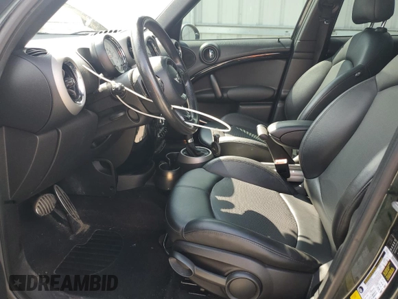 2012 MINI Countryman S with VIN WMWZC5C54CWL57554, listed as a Copart auction lot 59699865 with 144,737 mi miles and Salvage title. Bid and sale history available at DreamBid. Image 7.