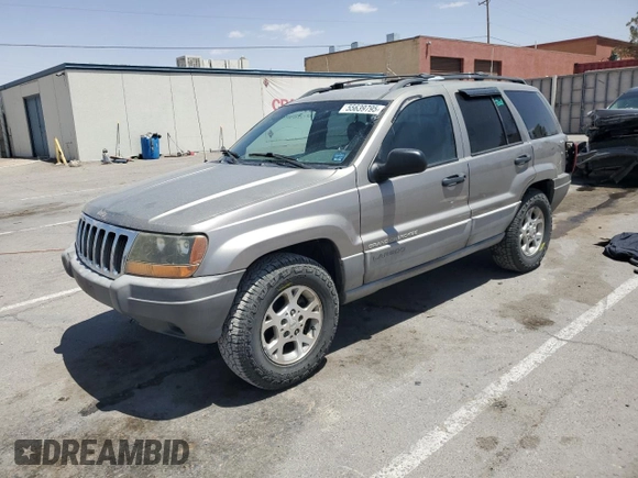 1999 Jeep Grand Cherokee Laredo with VIN 1J4GW58S1XC775877, listed as a Copart auction lot 55639795 with 197,611 mi miles and Salvage title. Bid and sale history available at DreamBid. Image 1.