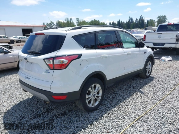 2018 Ford Escape SE z VIN 1FMCU9GD6JUB45046, wystawiony jako IAAI lot #42314262 z przebiegiem 107 962 mil mil oraz . Historia ofert i sprzedaży dostępna na DreamBid. Obrazek 4.