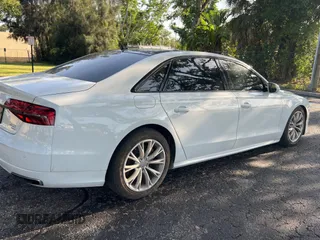 2017 Audi A8 Sport z VIN WAU43AFD7HN005619, wystawiony jako Copart lot #57526015 z przebiegiem 57 262 mil mil oraz Szkoda całkowita • Salvage title. Historia ofert i sprzedaży dostępna na DreamBid. Obrazek 4.